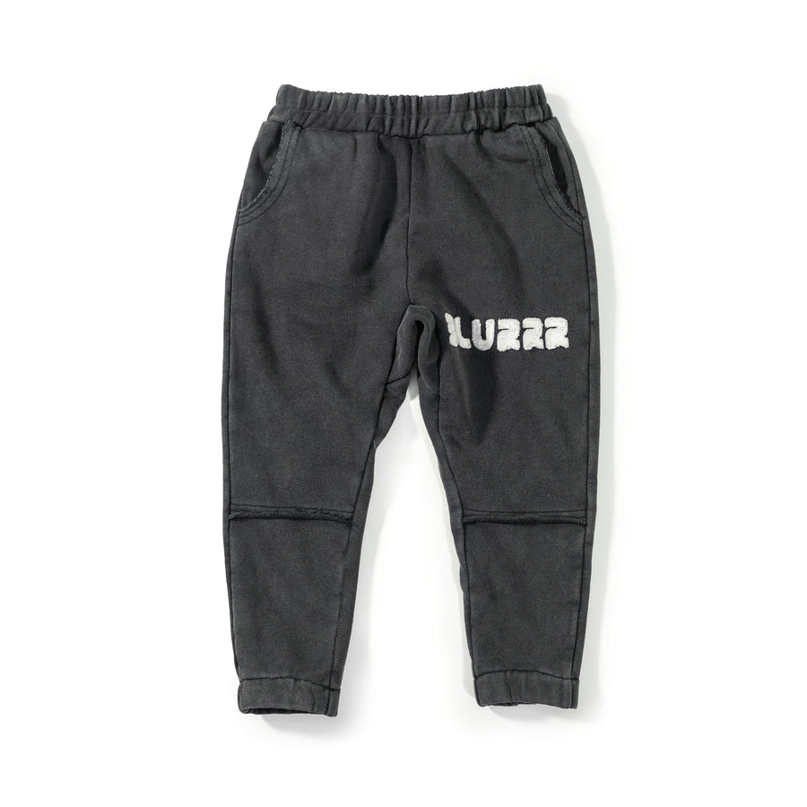 Dark gray sweatpants with a brand logo on a white background