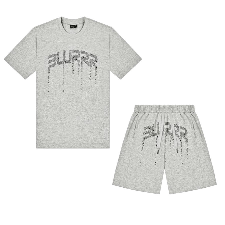 A light heather gray short-sleeve t-shirt and matching shorts set, both featuring a stylized metallic 'BLURRR' graphic with a dripping effect on the front, displayed against a solid black background.