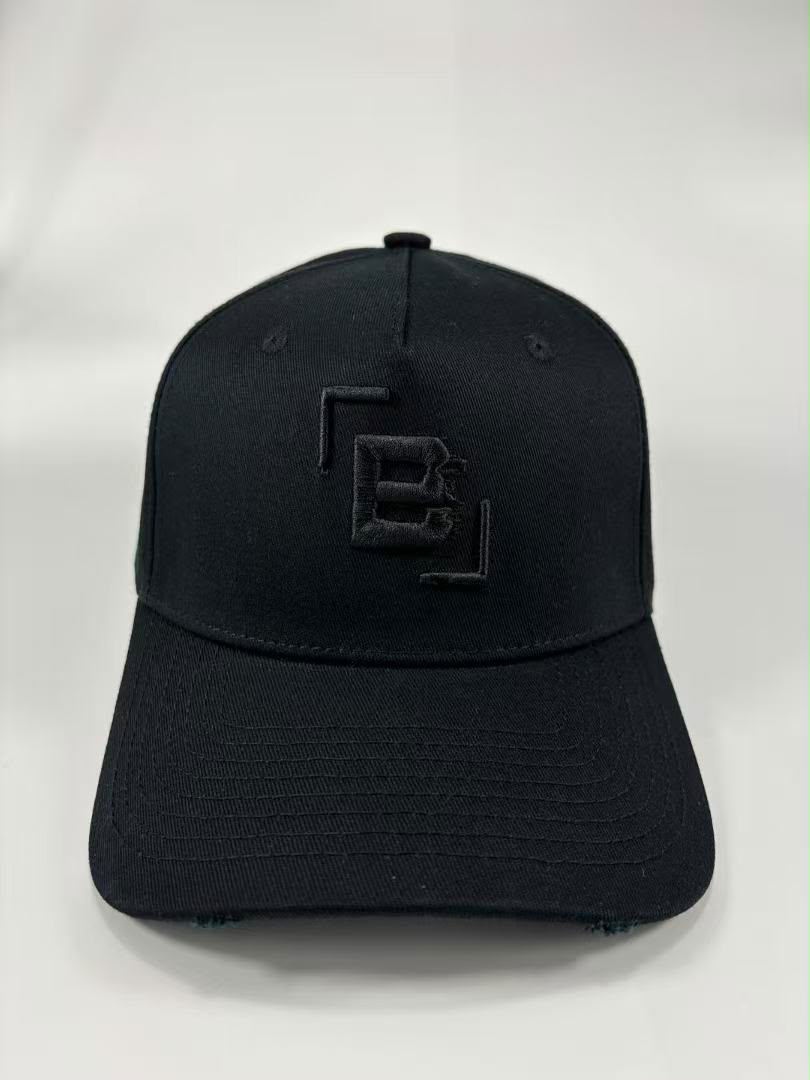 A black baseball cap with a tonal black embroidered logo on the front, photographed against a light grey background.