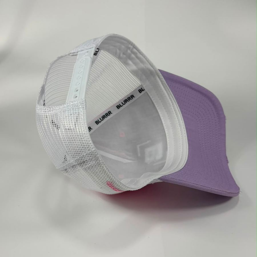 A trucker-style baseball cap with a lavender purple visor and white mesh back panels, shown on a plain light background.