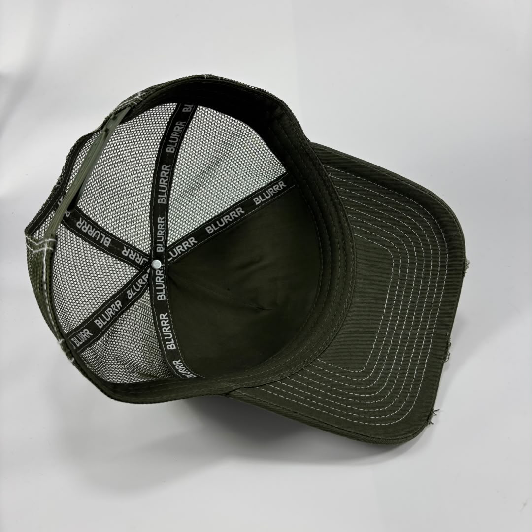 An olive green trucker-style cap shown from an angled top-down view, featuring a dark olive green mesh back with black diagonal support straps printed with the brand name 'BLURRR'.